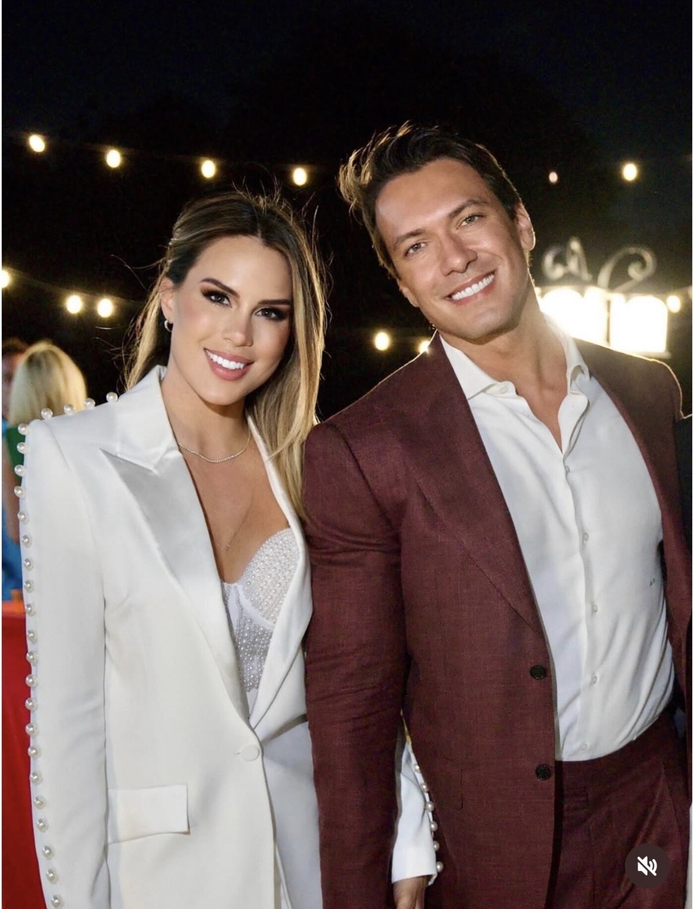Amanda and Mattia smiling together at their engagement party