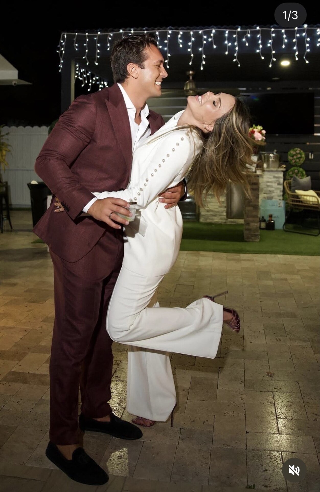 Mattia dipping Amanda as they laugh together at their engagement party