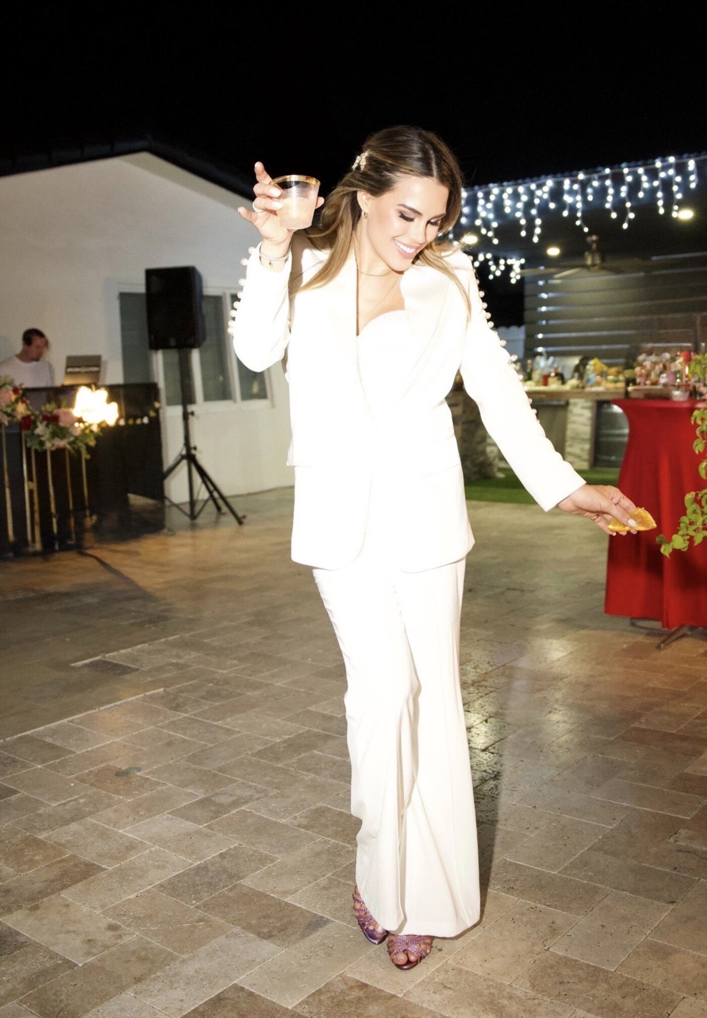 Amanda dancing and laughing at their engagement party