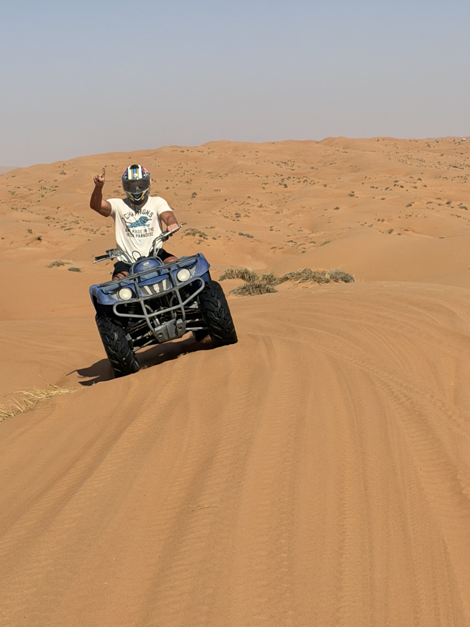 Cresting a dune on the ATV