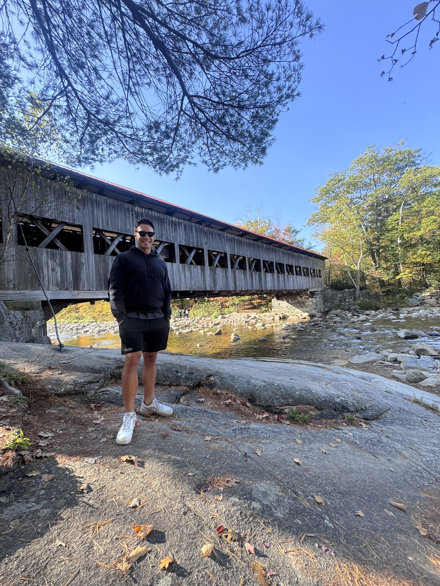 By the covered bridge over the river