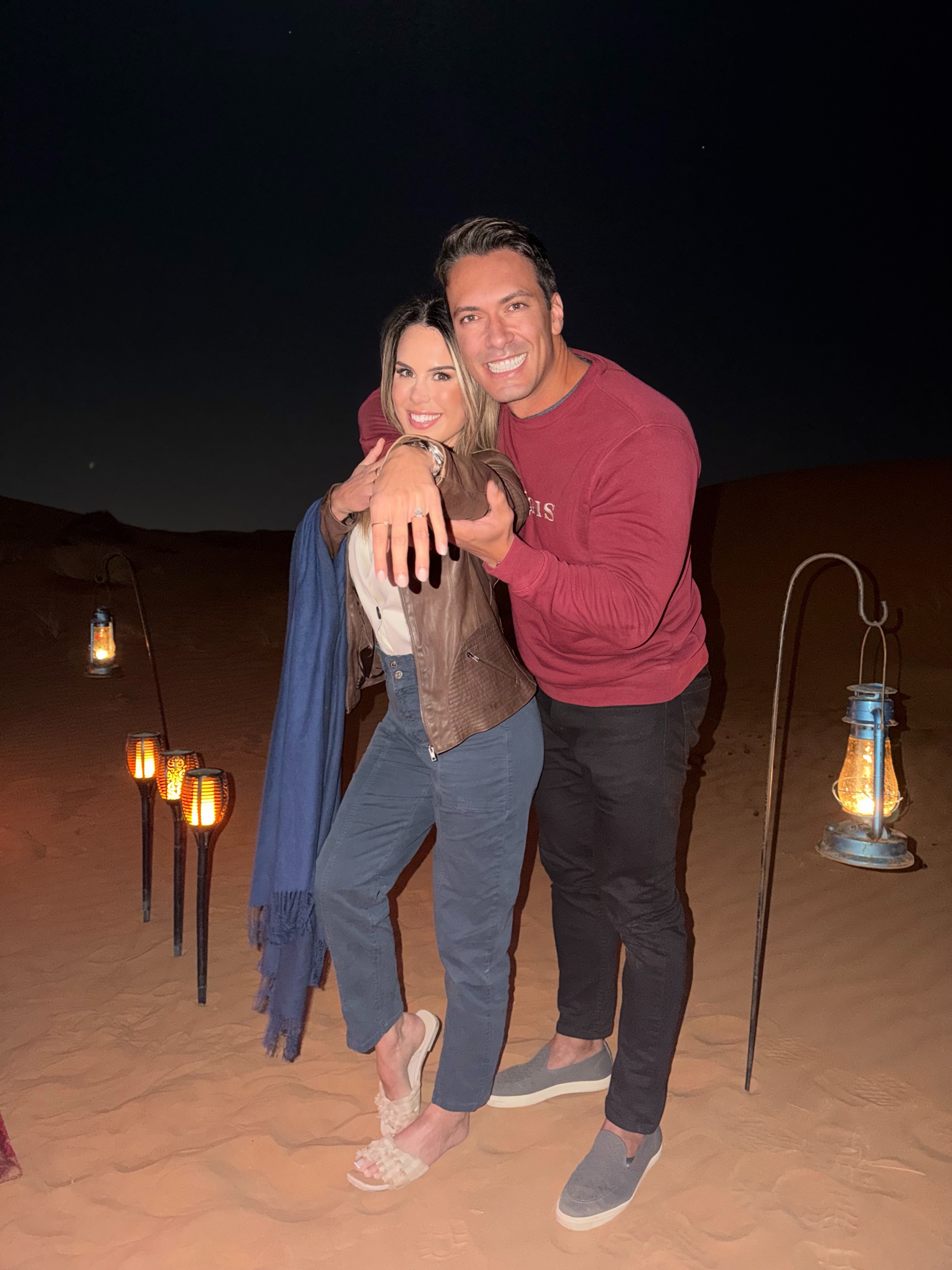 Showing off the ring under the desert lanterns