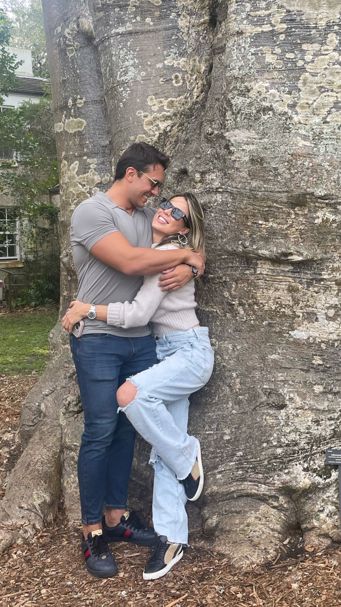 A hug by the big tree in the garden
