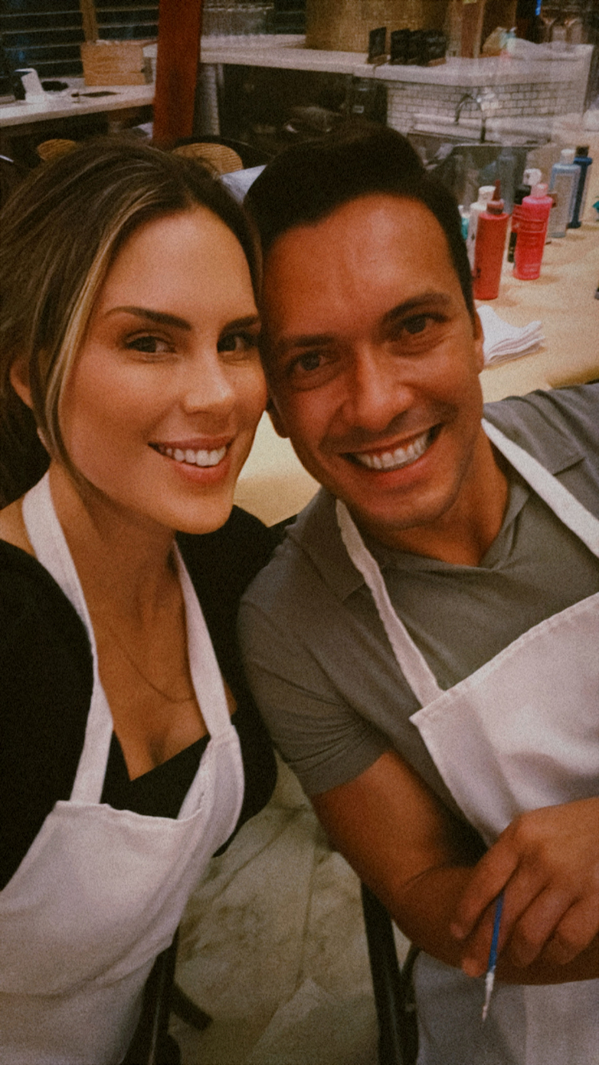Cooking together, aprons on