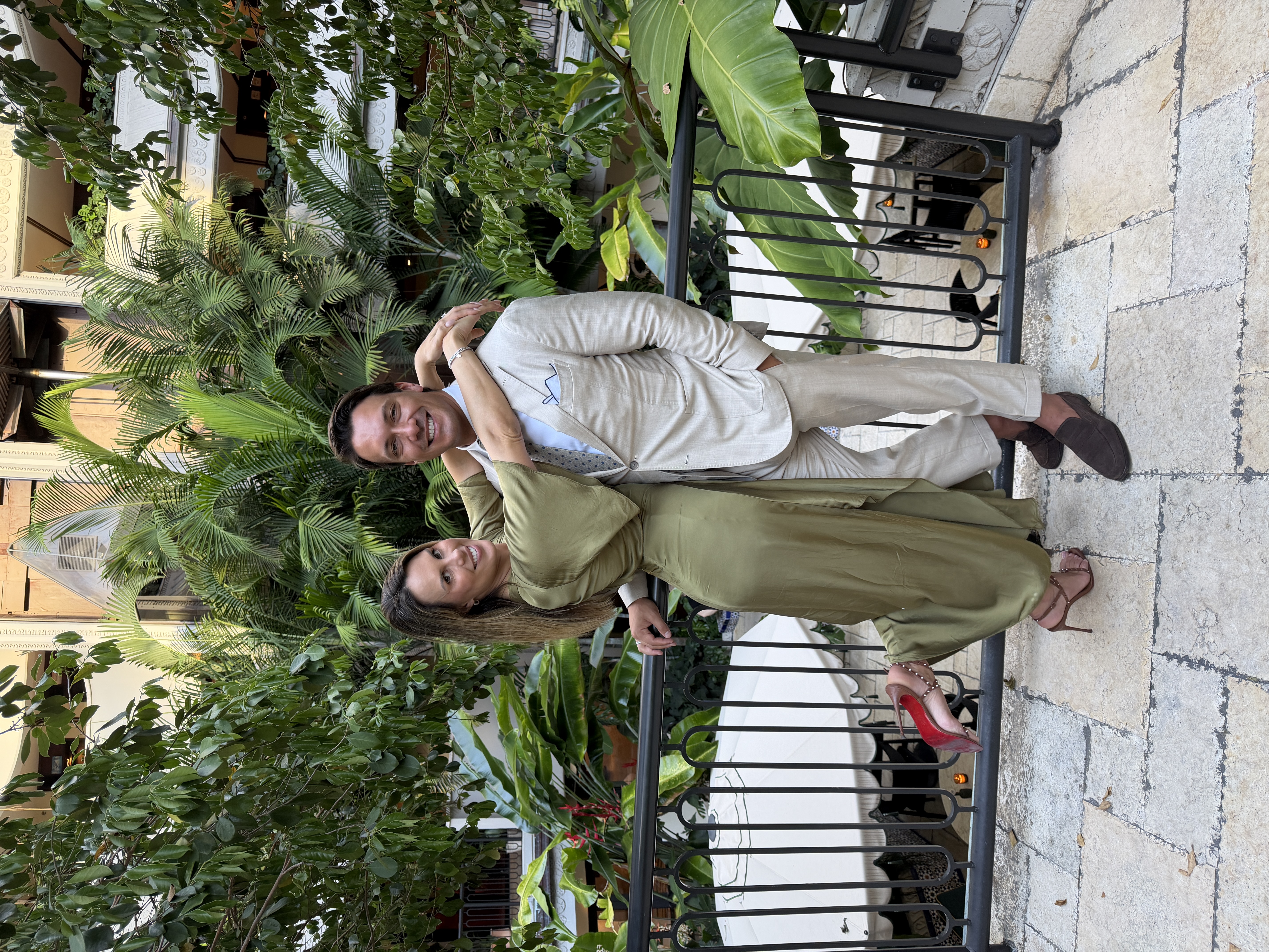 An embrace in a tropical courtyard